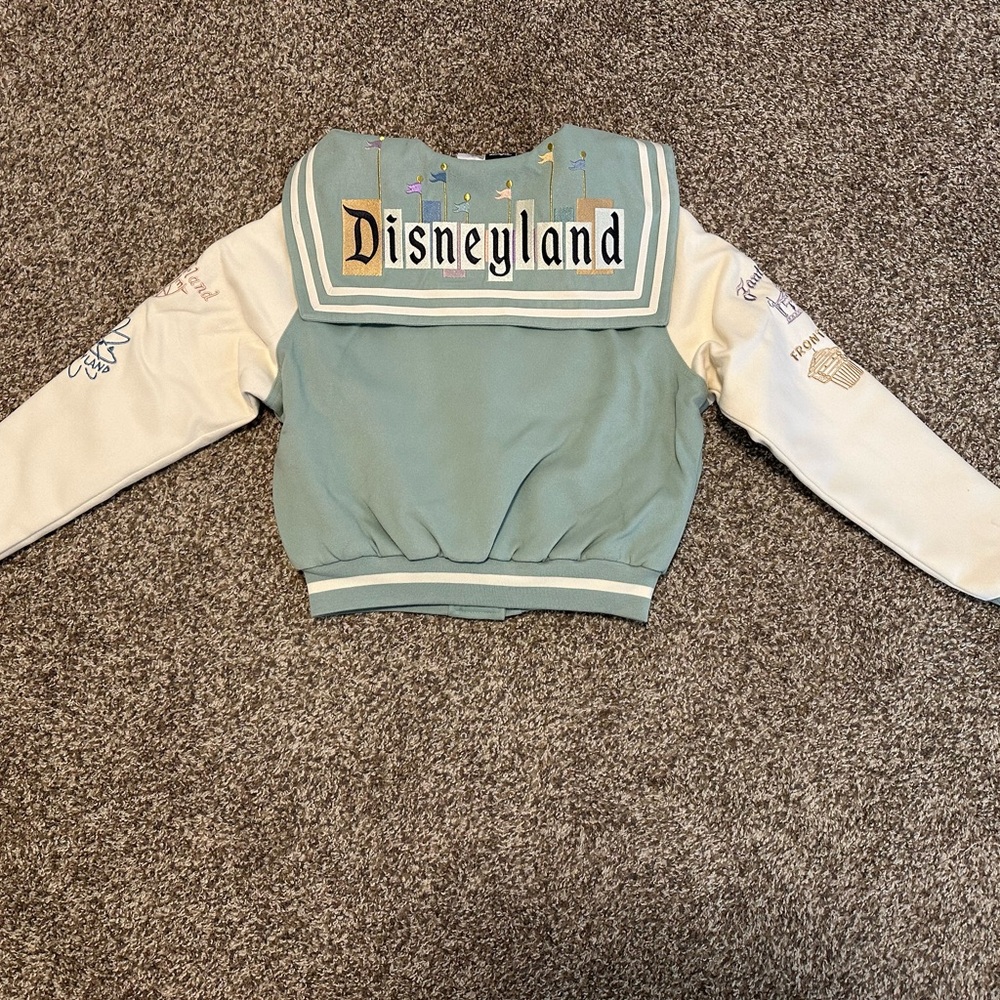 Her Universe Green and Cream Women’s Disneyland Varsity Jacket NWT